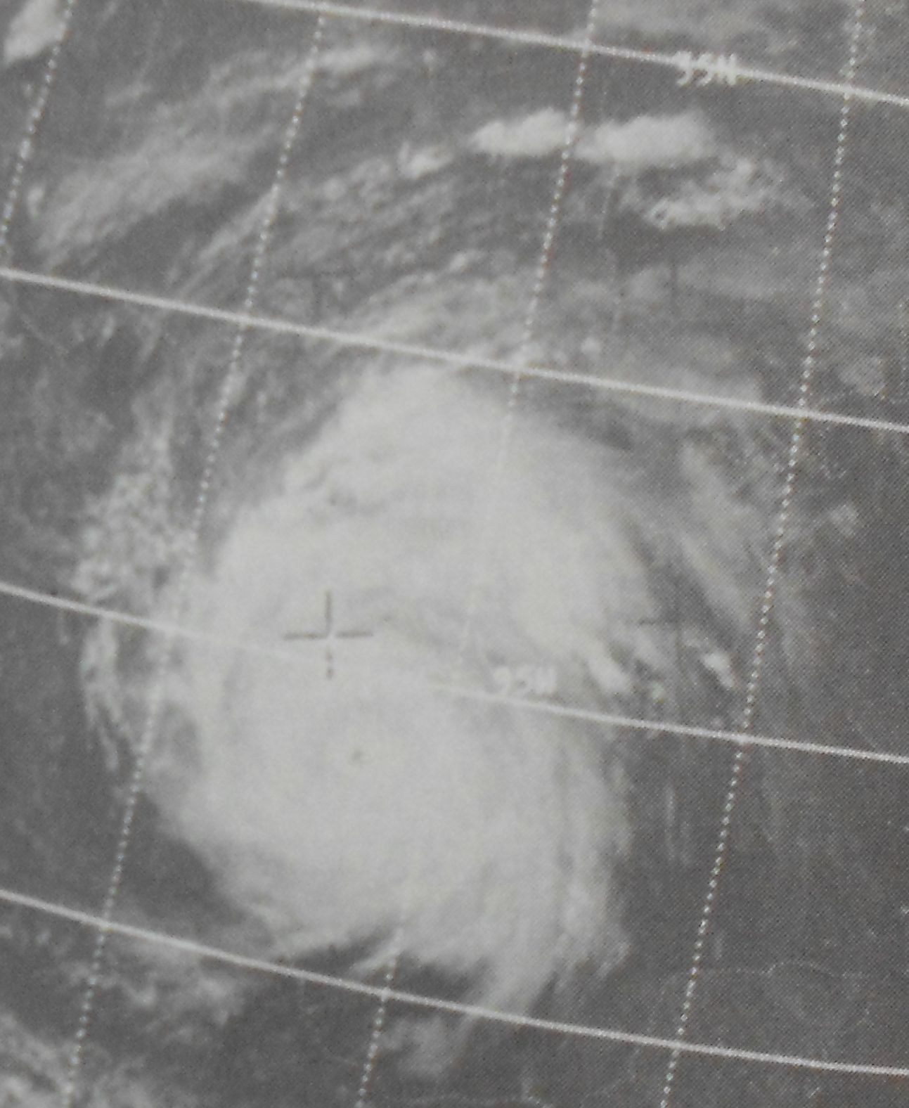 Black and white 1967 weather satellite image of Hurricane Beulah with a tight, well-formed eye over the western Gulf of Mexico, overlaid with latitude and longitude grid lines